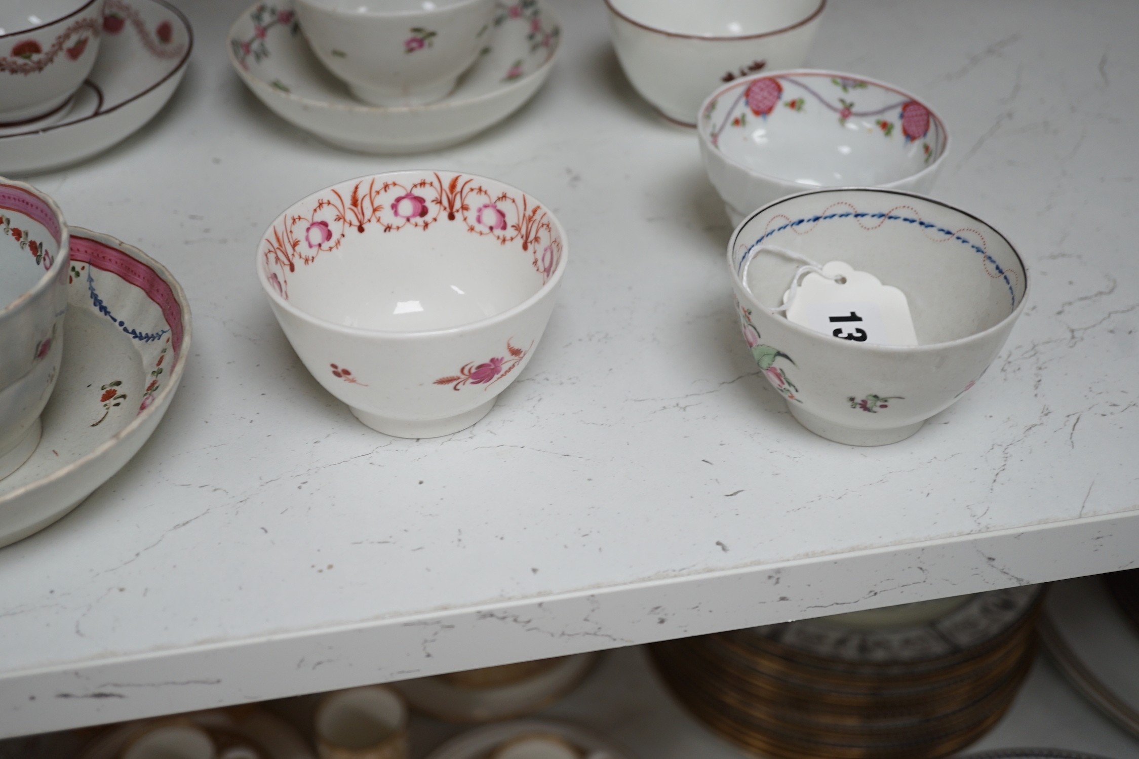 A quantity of Newhall teabowls and saucers and a pearlware tea bowl and saucer, c.1790-1800